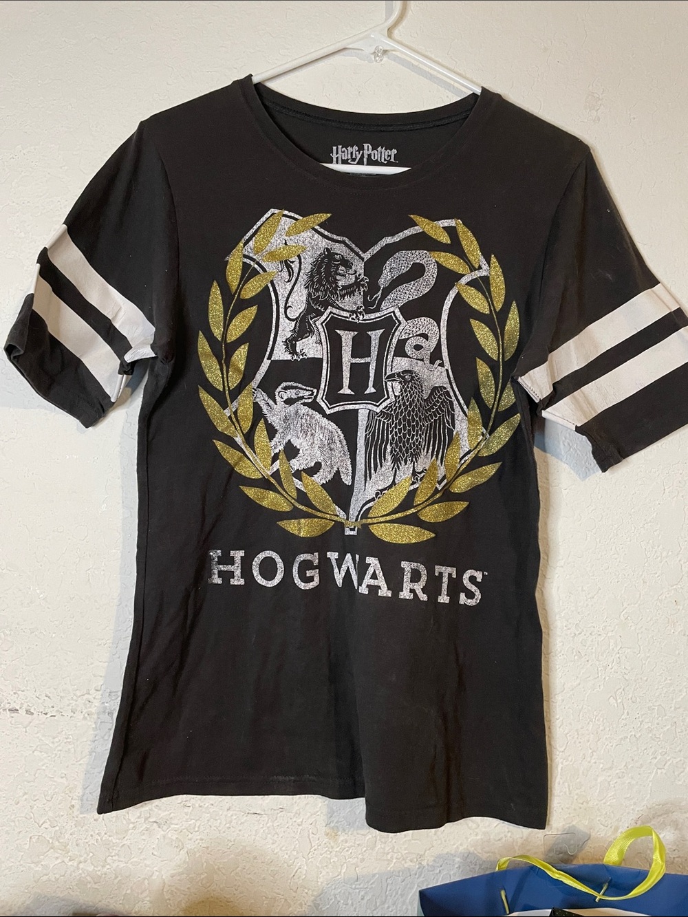 Warner Bros. Black Hogwarts Crest Tee with White Sleeve Stripes